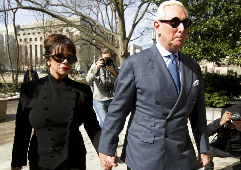 Former campaign adviser for President Donald Trump, Roger Stone accompanied by his wife Nydia Stone, left, arrives at federal court in Washington, Thursday, Feb. 21, 2019. Stone was ordered to appear in court over a Instagram post he made about U.S. Judge Amy Berman Jackson. (AP Photo/Jose Luis Magana)