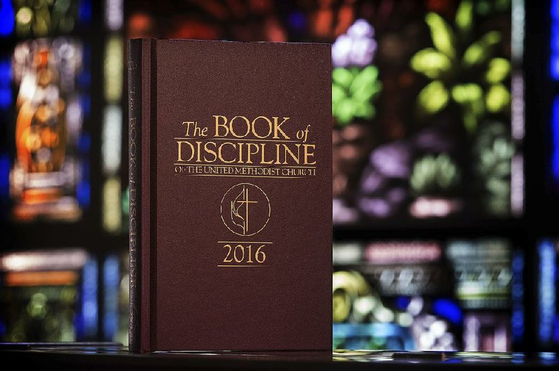 This 2017 photo provided by the United Methodist News Service shows the Book of Discipline, which contains the rules that guide The United Methodist Church. The church convenes its top legislative assembly today for a high-stakes four-day meeting likely to determine whether America’s second-largest Protestant denomination will fracture due to long-simmering divisions over same-sex marriage and the ordination of LGBT clergy. 