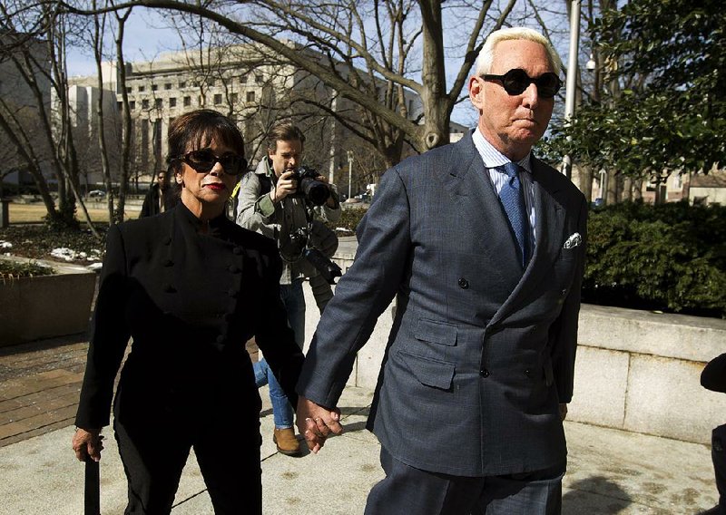 Roger Stone arrives for his federal court appearance Thursday in Washington with his wife, Nydia. 
