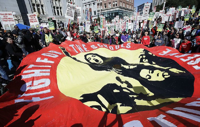 Striking teachers and their supporters rally Thursday in front of City Hall in Oakland, Calif. 