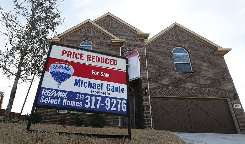 This for-sale sign in front of a home Wednesday in north Dallas shows that the seller has reduced the price. Sales of existing homes fell in January to the weakest pace since November 2015. 