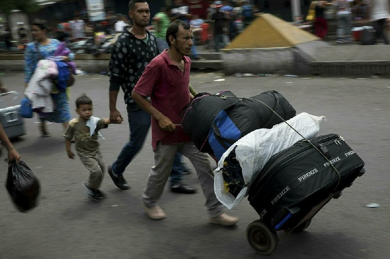 Venezuelans, hungry and facing medicine shortages, cross the Simon Bolivar bridge into Colombia on Thursday. 