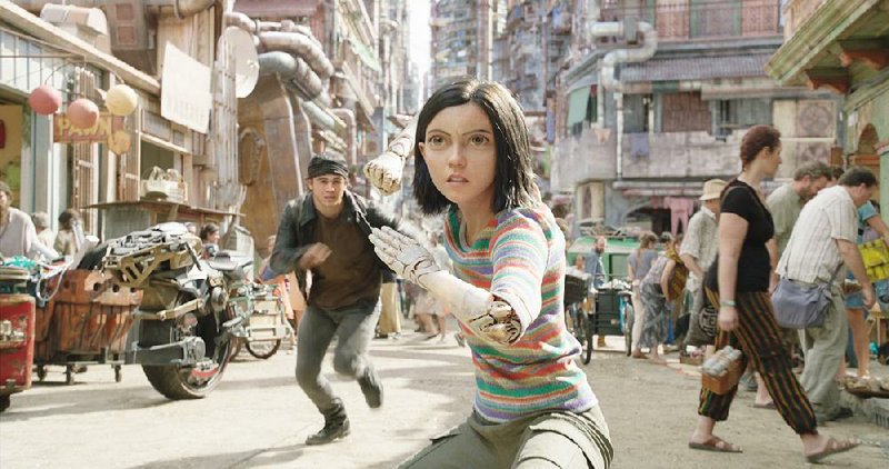 Keean Johnson (left) and Rosa Salazar (center) star in 20th Century Fox’s Alita: Battle Angel. It opened at the box office on Feb. 14, and came in at No. 1, earning an estimated $33.5 million.