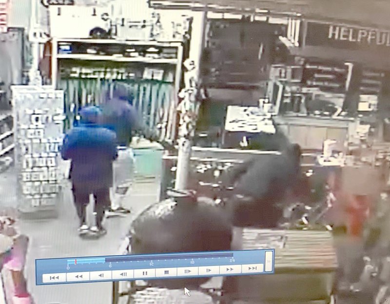 Courtesy Photo/PRAIRIE GROVE POLICE Three burglars are shown on a surveillance video at Prairie Grove Ace Hardware Store early Friday morning. The burglars broke into the store twice and stole weapons. Police arrested four teens in connection with the incident.