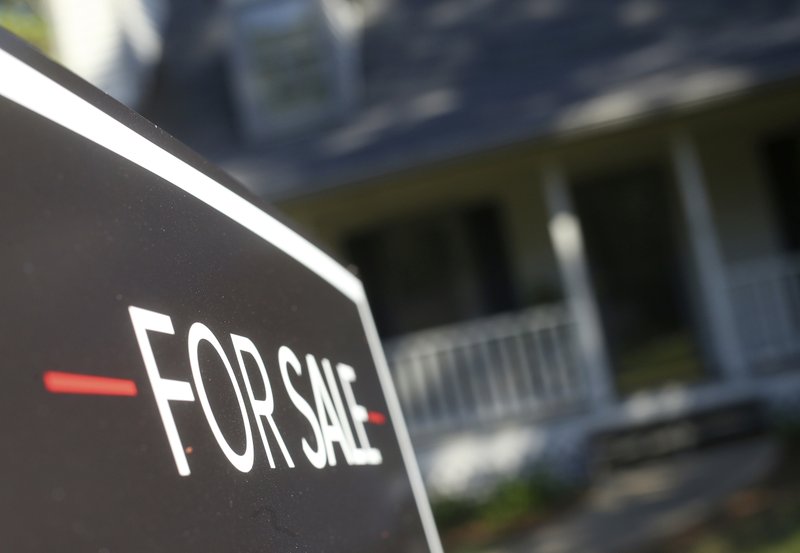FILE- This Oct. 3, 2018, file photo shows a home offered for sale in the Atlanta suburb of Roswell, Ga. On Thursday, Feb. 21, 2019, Freddie Mac reports on this week&#x2019;s average U.S. mortgage rates. (AP Photo/John Bazemore, File)