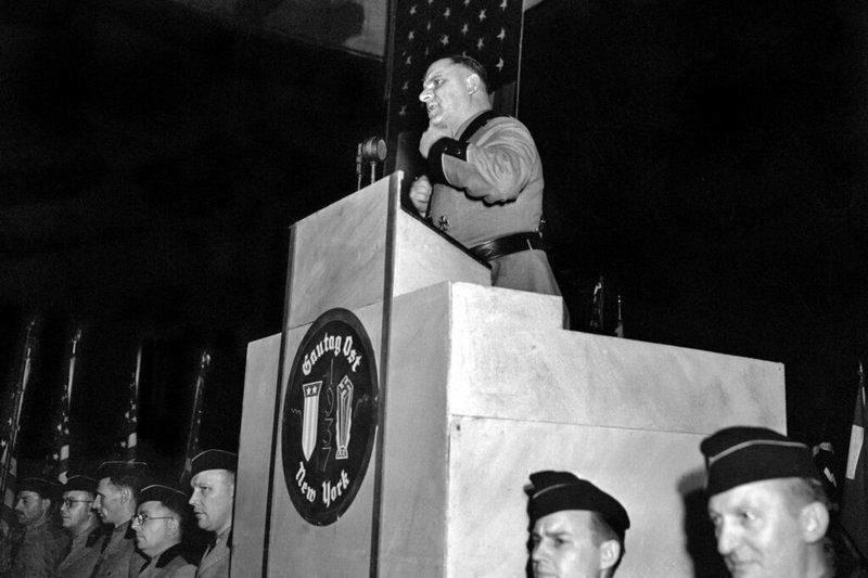 This Feb. 20,1939 file photo shows Fritz Kuhn, national leader of the Bund, in the full uniform of a Storm Trooper, as he speaks from the rostrum at Madison Square Garden in New York. The pro-Hitler rally that took place 80 years ago this week at New York's Madison Square Garden is the subject of a short documentary that's up for an Oscar this Sunday, Feb. 24, 2019. The film directed by Marshall Curry is called a "A Night at the Garden." (AP Photo, File)