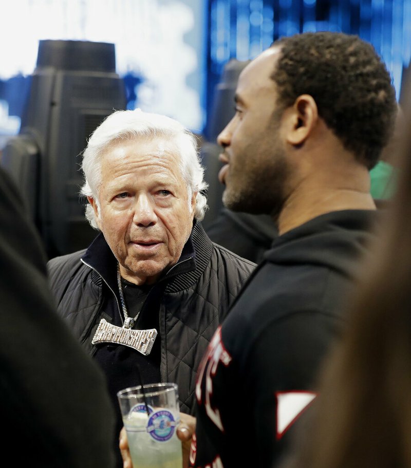 New England Patriots Owner Robert Kraft speaks to fans during the first half of an NBA All-Star basketball game, Sunday, Feb. 17, 2019, in Charlotte, N.C. (AP Photo/Chuck Burton)