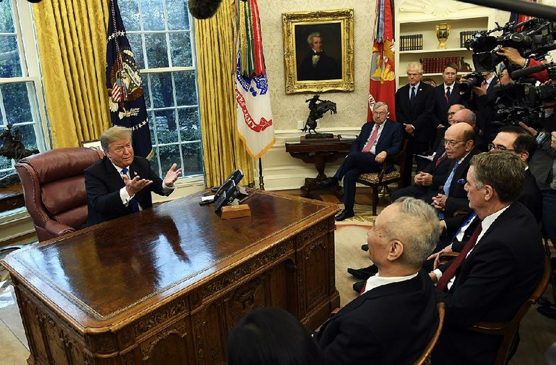 President Donald Trump meets with Chinese Vice Premier Liu He (foreground), special trade envoy, and U.S. trade negotiators Friday in the Oval Office of the White House. 