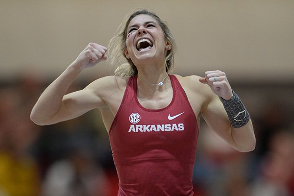 Arkansas' Lexi Jacobus celebrates clearing a height Saturday, Feb. 23, 2019, as she competes in the pole vault during the Southeastern Conference Indoor Track and Field Championship at the Randal Tyson Track Center in Fayetteville. 