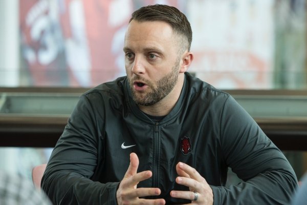 Joe Craddock, Arkansas offensive coordinator, talks to the press Thursday, Feb. 21, 2019, during a press conference with Arkansas football assistant coaches at the Smith Football Center in Fayetteville.