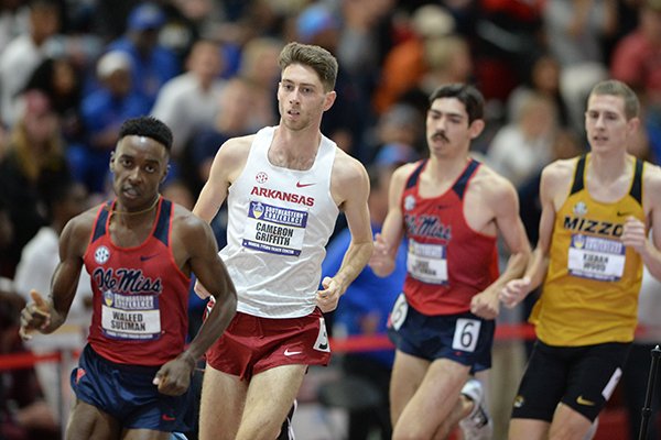 Arkansas' Cameron Griffith (center) trails Ole Miss' Waleed Suliman as he competes Saturday, Feb. 23, 2019, in the mile during the Southeastern Conference Indoor Track and Field Championship at the Randal Tyson Track Center in Fayetteville.
