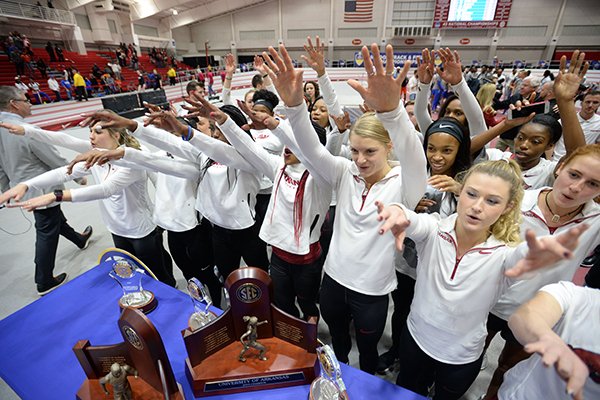 Members of the Arkansas women's indoor track and field team celebrates Saturday, Feb. 23, 2019, after winning the Southeastern Conference Indoor Track and Field Championship at the Randal Tyson Track Center in Fayetteville.