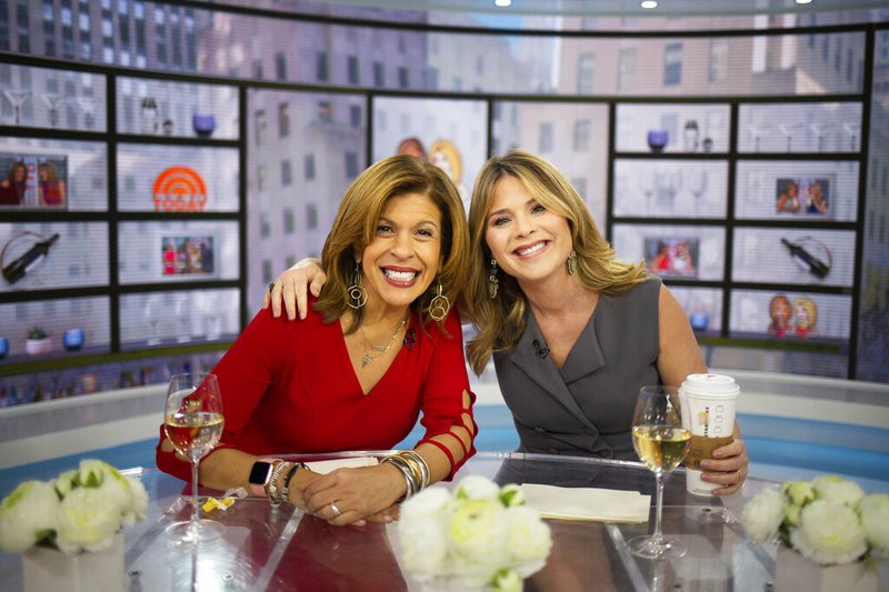 This Jan. 28, 2019 photo released by NBC shows Hoda Kotb, left, and Jenna Bush Hager during the fourth hour of the "Today" show in New York. NBC appointed Bush Hager as permanent co-host of the "Today" show's fourth hour with Kotb, replacing Kathie Lee Gifford in April. Kotb and Gifford were successful pioneers in expanding "Today," with an irreverent hour where glasses of wine were often kept close by. (Nathan Congleton/NBC via AP)