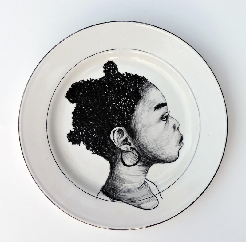 This plate is one of more than 200 on the walls as part of Delita Martin’s moving installation The Dinner Table. It is part of “On Their Own Terms,” an exhibition at the Brad Cushman Gallery in the Windgate Center for Art + Design at the University of Arkansas at Little Rock. (Photo courtesy of Delita Martin)
