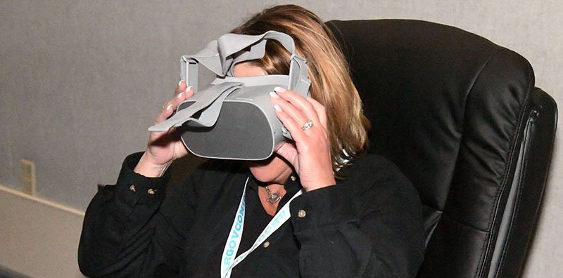 The Sentinel-Record/Grace Brown VIRTUAL REALITY: Heidi Ryan with Arkansas State Parks takes part in a virtual reality experience for Mountain Home and Hot Springs at the Governor's Conference on Tourism at the Hot Springs Convention Center on Tuesday.