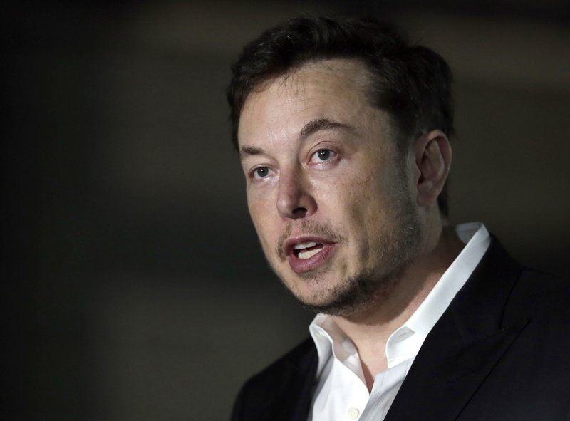 In this June 14, 2018, file photo, Tesla CEO Elon Musk speaks at a news conference in Chicago. (AP Photo/Kiichiro Sato, File)