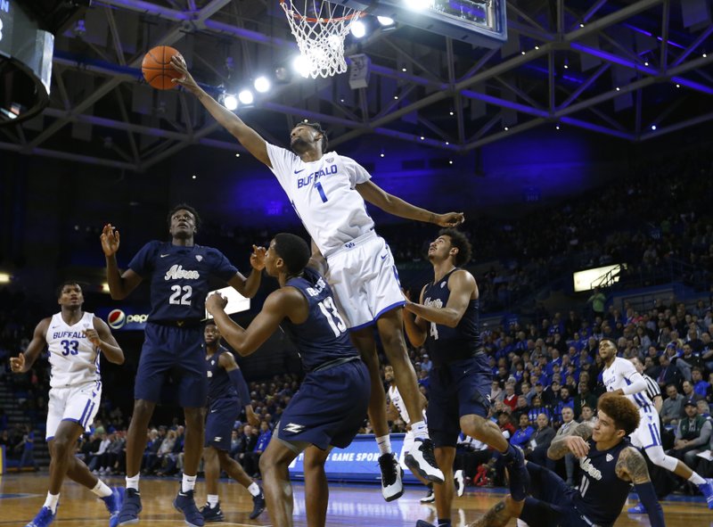 Buffalo forward Montell McRae (1) reaches for the ball against Akron during the first half of an NCAA college Basketball game, Tuesday, Feb. 26, 2019, in Buffalo N.Y. (AP Photo/Jeffrey T. Barnes)