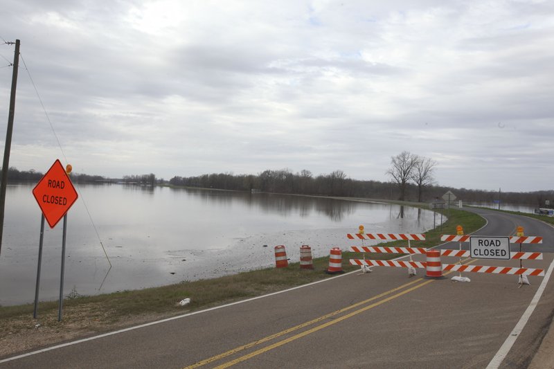 Highway 465 in Warren and Issaquena County is seen closed on the south end due to the rising flood waters north of Vicksburg, Miss., on Tuesday, Feb. 26, 2019. The Mississippi River is currently at 47.48 feet in Vicksburg according to the National Weather Service and is expected to crest at 51.4 feet on March 14, which is the highest crest since 2016 (Courtland Wells/The Vicksburg Post, via AP)

