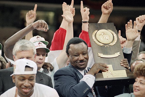 Arkansas coach Nolan Richardson shows off the NCAA National Championship trophy after the Razorbacks beat Duke 76-72, Monday, April 4, 1994, in Charlotte, N.C. (AP Photo/Ed Reinke)

