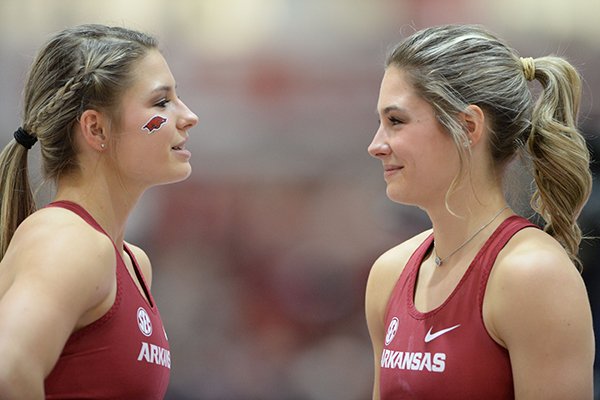 Arkansas pole vaulters Tori Hoggard (left) and Lexi Jacobus talk during the Southeastern Conference Indoor Track and Field Championships on Saturday, Feb. 23, 2019, in Fayetteville. 