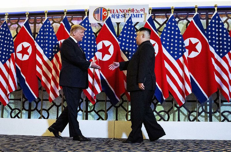 President Donald Trump and North Korean leader Kim Jong Un start their nuclear arms negotiations with a handshake Wednesday in Hanoi, Vietnam. 