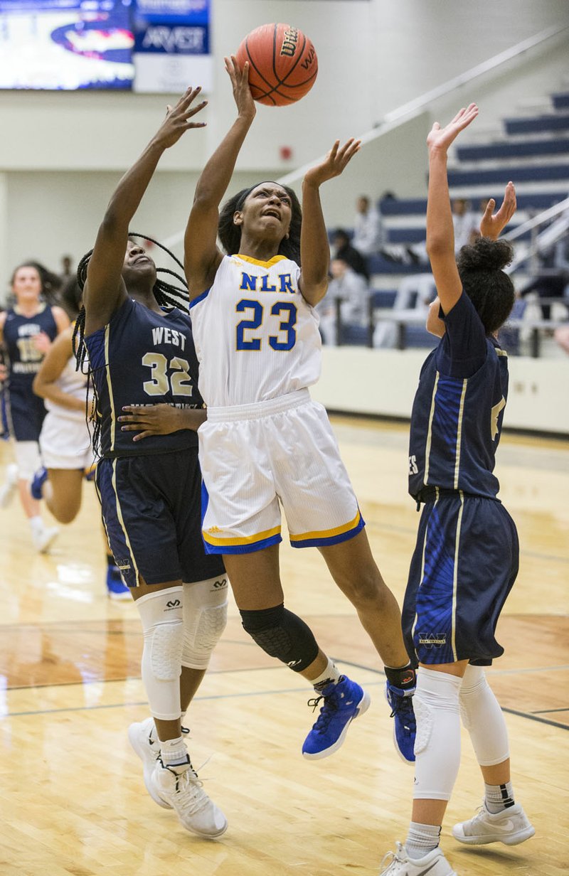 NWA Democrat-Gazette/BEN GOFF @NWABENGOFF Kennady Tucker (23) of North Little Rock makes a shot as Jada Curtis (32) and Kelsie Mahone of Bentonville West defend Wednesday, Feb. 27, 2019, in the first round of the class 6A basketball state tournament at Bentonville West's Wolverine Arena in Centerton.