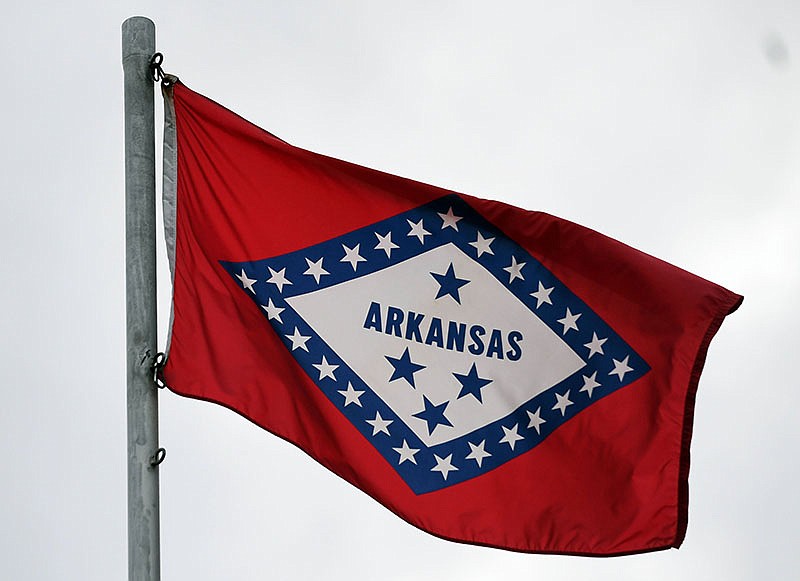 The Sentinel-Record/Grace Brown. The Arkansas state flag is shown flying