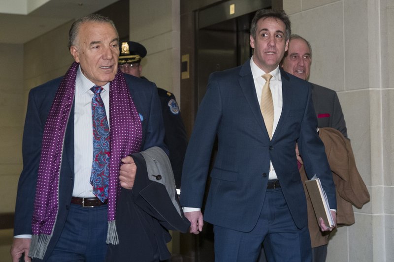 Michael Cohen, right, President Donald Trump's former personal lawyer, arrives to testify before a closed-door hearing of the House Intelligence Committee accompanied by his lawyer, Michael Monico of Chicago, on Capitol Hill, Thursday, Feb. 28, 2019, in Washington. (AP Photo/Alex Brandon)

