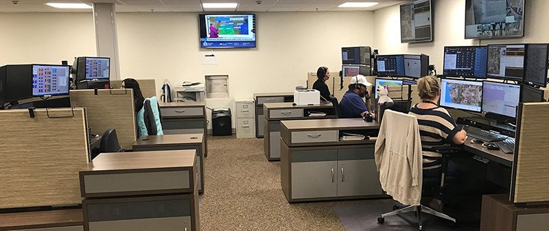 A handout file photo provided by the Garland County Department of Emergency Management in 2019 shows dispatchers working in the county’s 911 communications center. - Submitted photo