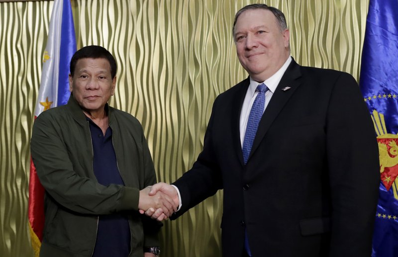 Philippine President Rodrigo Duterte, left, greets U.S. State Secretary Mike Pompeo upon arrival at Villamor Air Base in suburban Pasay city southeast of Manila, Philippines, Thursday, Feb. 28, 2019. Pompeo, who joined U.S. President Donald Trump in the second summit with North Korean leader Kim Jong-un in Vietnam, is here for talks on the two countries' relations as well as the mutual defense treaty. (AP Photo/Bullit Marquez, POOL)