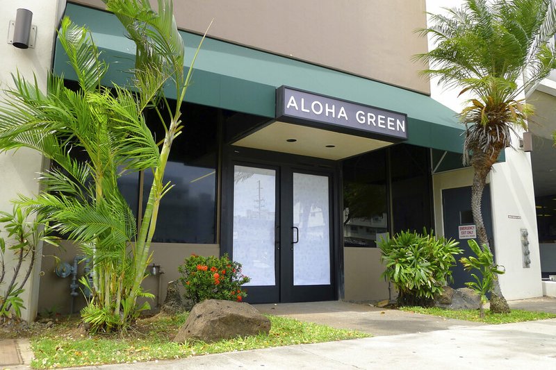 This June 6, 2017 file photo shows Aloha Green, a medical marijuana dispensary, in Honolulu. Hawaii is among the bluest of states; but when it comes to legalizing marijuana for adult use, the islands are out of step with fellow liberal stalwarts such as California and Vermont. Hawaii was the first state to legislatively approve medical marijuana in 2000, but it took island lawmakers another 15 years to set up a dispensary system. (AP Photo/Cathy Bussewitz, File)