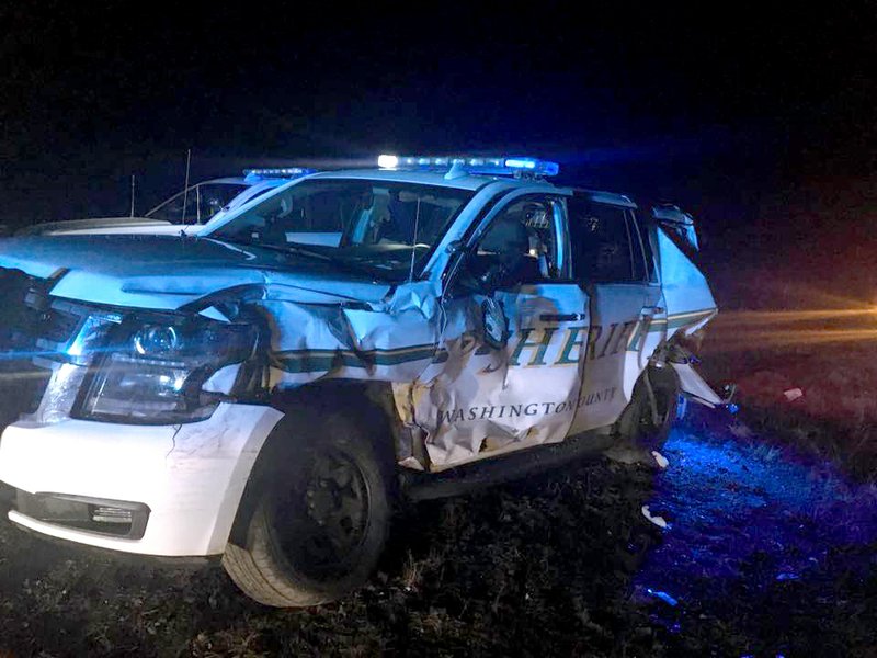 A vWashington County sheriff's office vehicle was struck by an 18-wheeler while working a wreck early Friday morning on an icy Interstate 49 south of West Fork. No one was injured. Photo courtesy of Washington County sheriff's office
