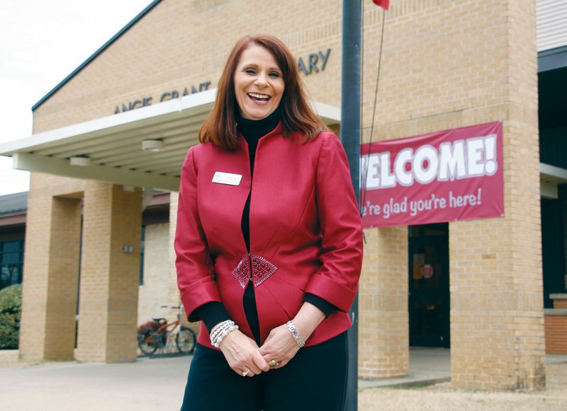 Laura Baber, the chief financial officer for the Benton School District, stands in front of Angie Grant Elementary School in Benton. Baber served as principal for Angie Grant for seven years before becoming CFO. She plans to retire from the district at the end of the school year.