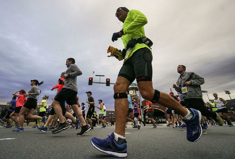 Runners participate in last year’s Little Rock Marathon. More than 10,000 runners are expected to take part in this year’s race Sunday.