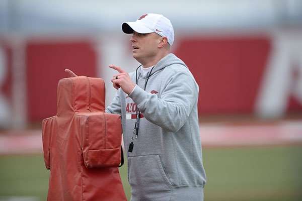 Arkansas receivers coach Justin Stepp talks to players during practice Friday, March 1, 2019, in Fayetteville. 