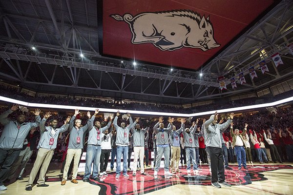Members of Arkansas' 1994 national championship basketball team are recognized during a ceremony on Saturday, March 2, 2019, in Fayetteville. 