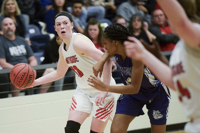 Fort Smith Northside forward Sara Bershers (left) looks to throw a pass to a teammate Saturday during the Lady Grizzlies’ 64-62 victory over Fayetteville in the Class 6A state tournament semifinals in Centerton.