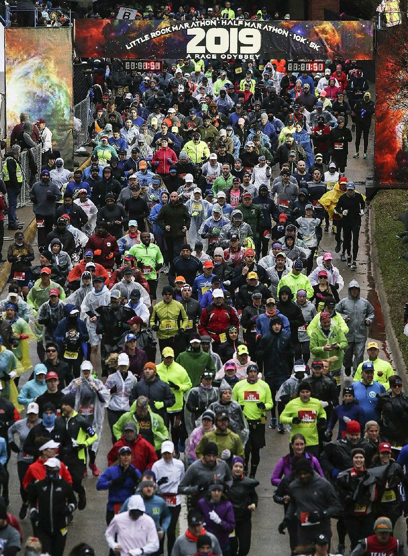 Runners head off during the start of the 2019 Little Rock Marathon Sunday, March 3, 2018 in Little Rock.