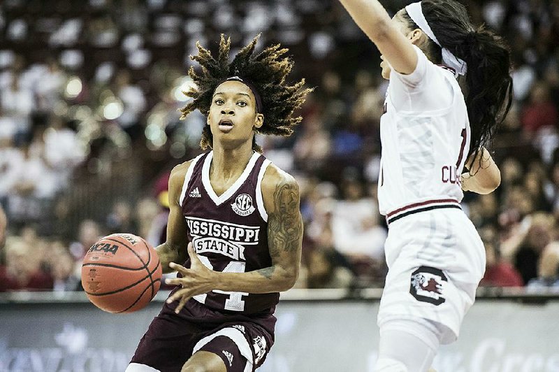 Mississippi State guard Jordan Danberry (Conway) (left) drives to the hoop against South Carolina guard Bianca Cuevas-Moore (1) during the Bulldogs’ 68-64 victory over South Carolina. With the victory, Mississippi State also won the SEC regular season title.