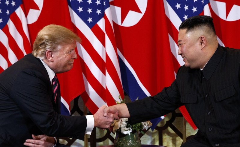 FILE - In this Wednesday, Feb. 27, 2019, file photo, U.S. President Donald Trump shakes hands with North Korean leader Kim Jong Un in Hanoi. Trump said he walked away from his second summit with North Korean leader Kim Jong Un because Kim demanded the U.S. lift all of its sanctions, a claim that North Korea's delegation called a rare news conference in the middle of the night to deny. (AP Photo/ Evan Vucci, File)