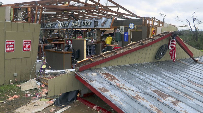In this Sunday, March 3, 2019 photo, debris litters the Buck Wild Saloon, after it was heavily damaged by a tornado, in Smiths Station, Ala. (Mike Haskey/Ledger-Enquirer via AP)

