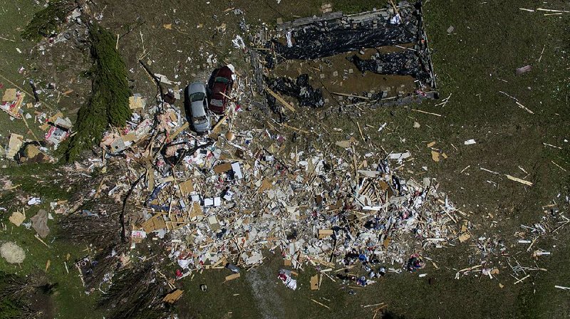 Little more than debris remains Tuesday of a house in Beauregard, Ala., that was blown off its foundation when a tornado struck the town Sunday, killing 23 people. Officials released the names of the victims Tuesday, including Armando Hernandez Jr., a 6-year-old boy torn from his father’s arms. 