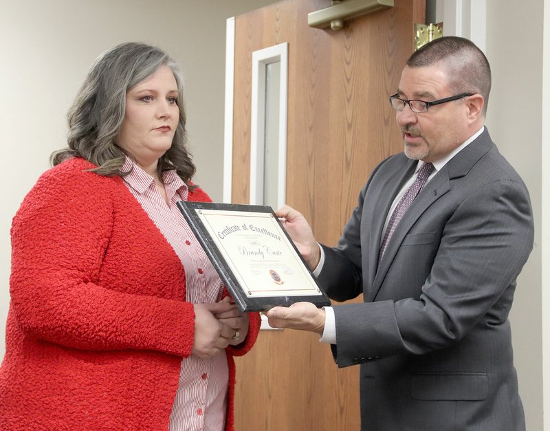 LYNN KUTTER ENTERPRISE-LEADER J.P. French, director of strategic accounts with RAVE Mobile Safety, recognizes special education teacher Brandy Carte for her quick action in using the RAVE App to notify teachers, emergency responders and others about a medical emergency with a student at Prairie Grove Elementary School.