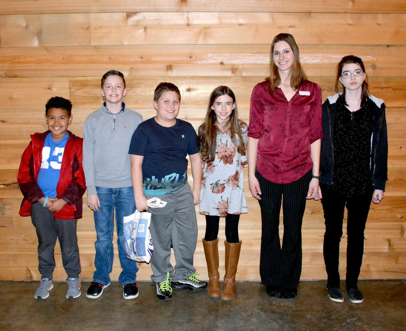 Westside Eagle Observer/JANELLE JESSEN Boys and Girls Club of Western Benton County honored the Gravette site Youths of the Month and announced the Gravette Youth of the Year during a banquet on Feb. 19. Pictured (from left) are Youth of the Month Cooper White, Youth of the Year Cameron Bedwell, Youths of the Month Ryan Butler and Kaelyn Powell, administrative director and former Gravette unit director Ashley Oosterman, and Youth of the Month Saphfire Hollaway. Not pictured are Youths of the Month Preston Legrand, Malliya Davis, Matthew Wright, Conner Reinking and Cade Phillips.