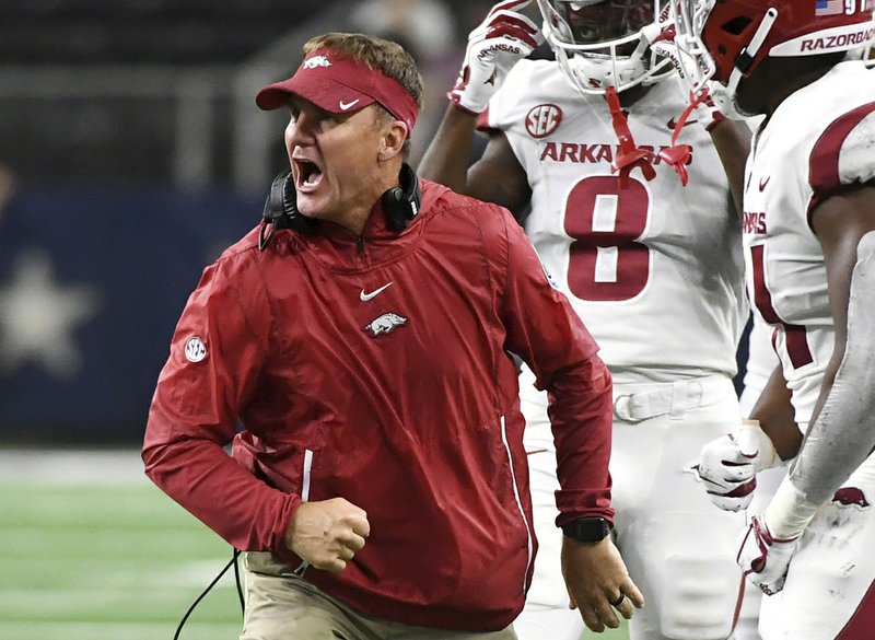 FILE - In this Sept. 29, 2018, file photo, Arkansas head coach Chad Morris celebrates with his players after a missed field goal by Texas A&M during the fourth quarter of an NCAA college football game, in Arlington, Texas. (AP/Jeffrey McWhorter, File)