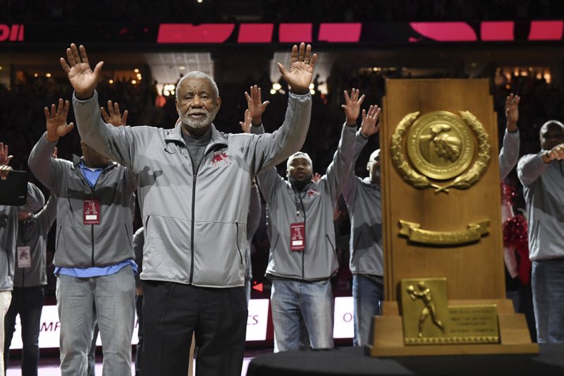 Former Arkansas coach Nolan Richardson calls the hogs with members of the 1994 Razorback National Championship basketball team during half time of an NCAA college basketball game, Saturday, March 2, 2019 in Fayetteville, Ark. The ceremony marked the 25 year anniversary of the National Championship game. (AP Photo/Michael Woods)

