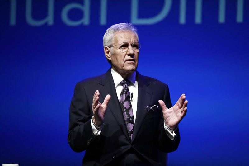 In this Oct. 1, 2018, photo, moderator Alex Trebek speaks during a gubernatorial debate between Democratic Gov. Tom Wolf and Republican Scott Wagner in Hershey, Pa. "Jeopardy!" host Trebek says he has been diagnosed with advanced pancreatic cancer. In a video posted online Wednesday, March 6, 2019, Trebek said he was announcing his illness directly to "Jeopardy!" fans in keeping with his long-time policy of being "open and transparent." (AP Photo/Matt Rourke)