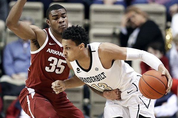 Vanderbilt forward Matthew Moyer (13) drives against Arkansas forward Reggie Chaney (35) in the first half of an NCAA college basketball game Wednesday, March 6, 2019, in Nashville, Tenn. (AP Photo/Mark Humphrey)

