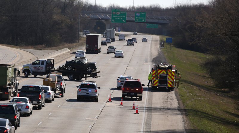 Authorities clear an accident in the eastbound lanes of I-40 near North Hills Boulevard in North Little Rock on Wednesday.
