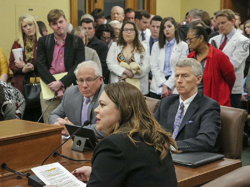 In this file photo optometrist Dr. Belinda R. Starkey (seated, center) speaks to legislators in favor of House Bill 1251, which would allow optometrists to perform certain types of surgery. Bill sponsor state Rep. Jon S. Eubanks, R-Paris, (seated from left) and supporter Dr. David Cockrell listen. The bill failed in the House Public Health Welfare and Labor Committee. 
